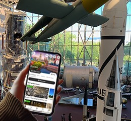 Visitor browsing the WLKTours app on their phone at the Smithsonian National Museum of Natural History